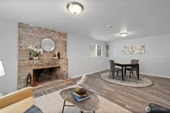 Light and bright modern touches in the lower level with the cozy fireplace make for a welcoming space.