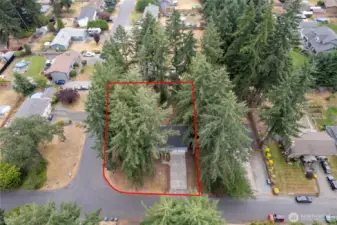 The red border is approximate for this fenced, quarter acre corner lot!