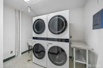 Oversized double washer and dryer located just down hall from unit 402.
