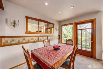The welcoming dining room includes a door onto the back patio.