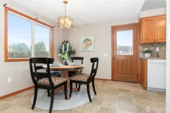 Dining with door to driveway and garage