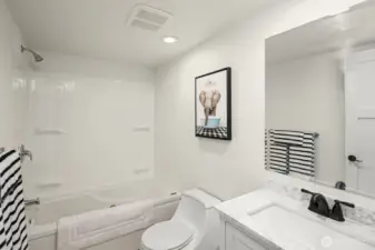 This full bath is shared by the three bedrooms on one side of the house.