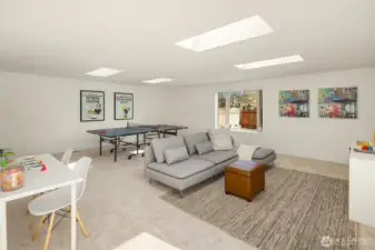 Large multi purpose rec room at the back of the house is filled with natural light. Skylights bring in additional light.