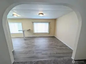 Arched doorway leads to the dining room & kitchen.