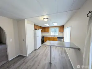 New flooring in the vaulted kitchen. Eating area.