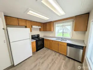 Kitchen overlooks huge backyard.