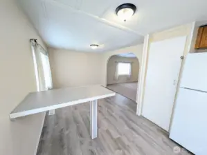 Another look at the vaulted kitchen, eating & dining areas.