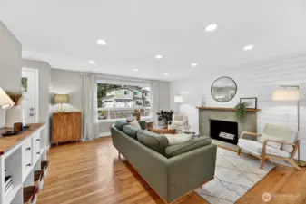 Hardwood floror, recessed lighting, big picture windows, cozy fireplace.