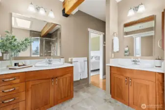 The primary suite offers a peaceful retreat, positioned to capture stunning mountain views. Wake up to natural beauty and end each day in quiet comfort. It’s a space designed for rest and rejuvenation.