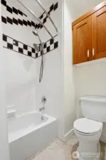 Full guest bath with separate shower and W/C.
