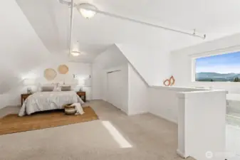 Spacious studio above the garage has a 3/4 bath and kitchenette. Use as a potential rental, office space or guest quarters, you decide! The studio has a separate entry from the main house. Gorgeous mountain views.