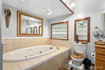 This is the Large bathroom located downstairs on the main floor has a soaking tub, vanity & shower ect.