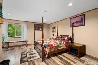 This is the second bedroom located on the main floor it is very spacious and over looks the picturesque views of the front yard and gardened beds out front
