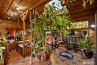 This is the solarium room located on the main floor and has a hot tub that will stay with the property