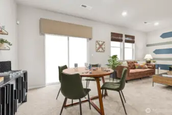 Dining area with slider to rear yard. Photos are representative only and may display different color package and/or upgrades.