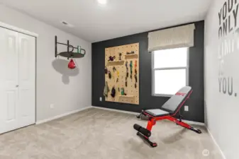 Guest bedroom utilized as a workout space showing the versatility of this floorplan. Photos are representative only and may display different color package and/or upgrades.