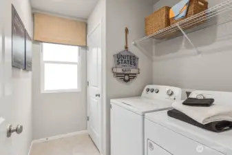 Convenient upstairs laundry room. Photos are representative only and may display different color package and/or upgrades.