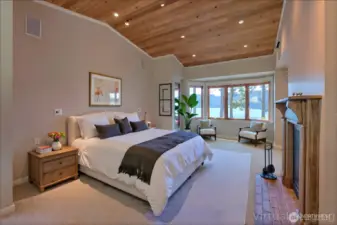 Beautiful Primary bedroom with views,  fireplace and second door leading to flex room that leads to kitchen  - virtually staged