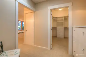 Primary bedroom changing room leading into Ensuite closet and bathroom
