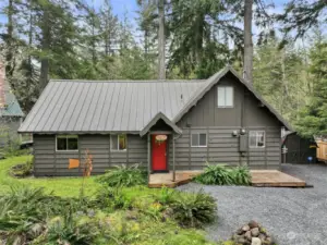 Beautiful cabin with newer metal roof and new exterior paint.