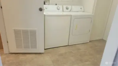 Laundry room off kitchen.