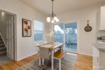 Breakfast nook with slider to the covered back patio. Stairway leads to the bonus room over the garage.