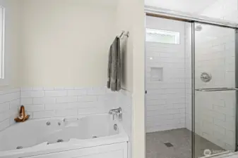 Jetted tub and large subway tiled shower is also a Jack n Jill to 1/2 bath and 4th bedroom
