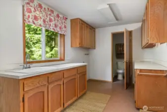 The laundry/mud room is right off the kitchen with access to the garage.