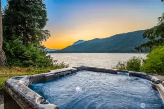 Soak in the hot tub with breathtaking mountain and lake views.