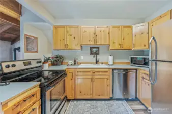 Modern kitchen with stainless steel appliances included for your convenience.