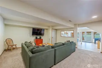 Large sectional sofa provides plenty of comfortable seating for movie nights or gatherings.