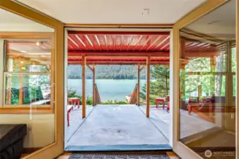 Covered patio off the basement with comfortable seating, perfect for year-round relaxation.
