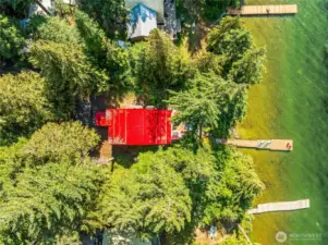 Aerial view showcasing the beautiful 0.40-acre lot and Fish Lake waterfront