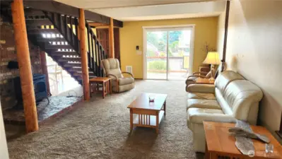 Living room with sliding glass doors to front deck