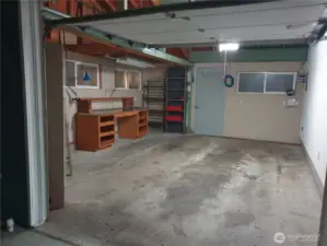 Main House oversized garage with work or storage area.