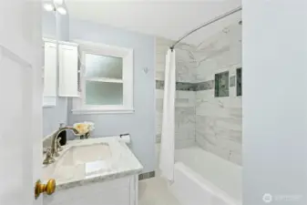 Tastefully updated full bath upstairs next to primary bedroom.