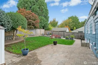 Fully fenced backyard has paver patio, electric awning & easy care lawn. Fun for pets & kids of all ages here year round.