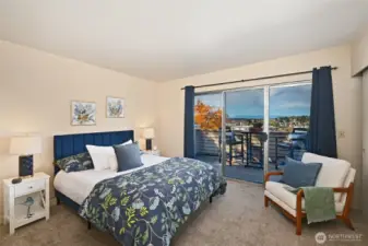 Primary bedroom with sliders to large, view deck