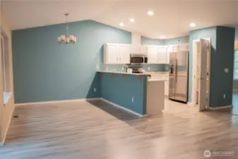 Welcome to the inviting dining area, a perfect space to enjoy delicious meals and good company. This charming setting promises a delightful dining experience every time you visit.