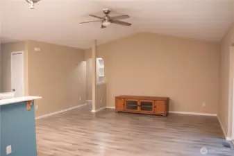 This home features an open-concept layout. While cooking in the kitchen, you can easily stay engaged with the family room.