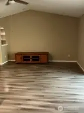 This home features an open-concept layout. While cooking in the kitchen, you can easily stay engaged with the family room.