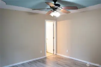 Spacious and stunning primary bedroom features a walk-in closet, perfect for relaxing and unwinding in style.