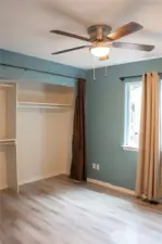 The second bedroom offers a spacious and inviting room, perfect for relaxing or entertaining