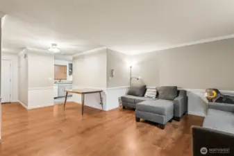 Living Room with wood fireplace & Dining Area off Kitchen