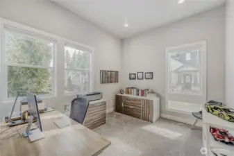 The bright and spacious main level office inspires creativity and focus.