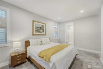 The second bedroom guest suite features a 3/4 en-suite bath and a walk-in closet.