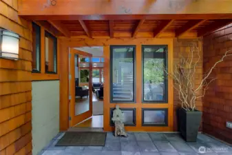 Main entrance, with shingle siding and fir-clad windows & doors.