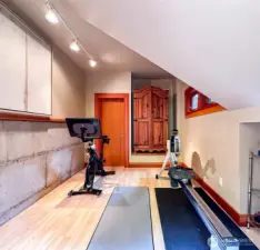 Home gym is tucked outside the main entrance.