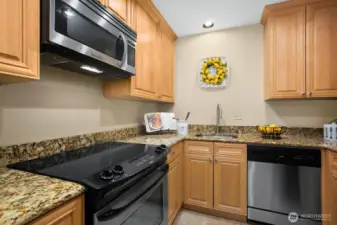 Nicely updated kitchen with stainless appliances that stay with the unit