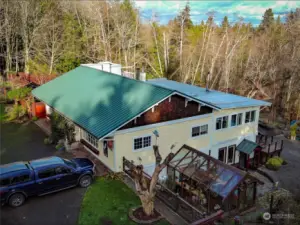 4600 Sq Ft Residence/Showroom/Workshop! It's all here in one spot with over 7 additional acres of undeveloped land! There's a chicken coop, gardens and a rock-climbing wall, too!